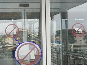 Neat warning on airport door...